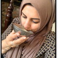 Multaka Volunteer Marriam drinking from her Healing Bowl, a gift from her father