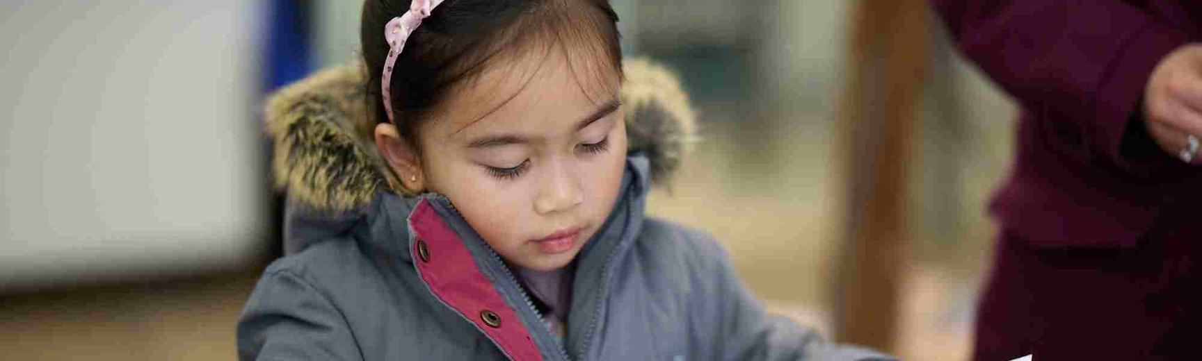 Primary schools taught session: Mini Space Explorers (Early Years) banner image Young girl doing activity