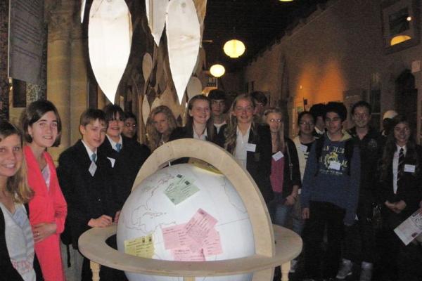 Winners of Activity photo showing Dux Awards Scheme students with the globe