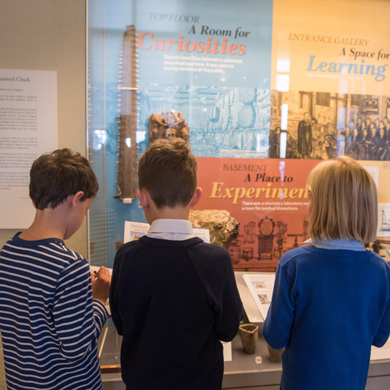 Children exploring a display in the Entrance Gallery at the History of Science Museum Children exploring a display in the Entrance Gallery at the History of Science Museum