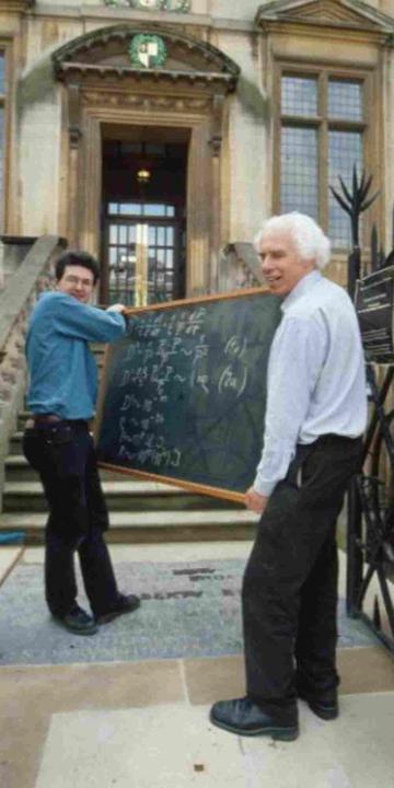 Einstein carriers: Professor Jim Bennett and Dr Stephen Johnston with Einstein's Blackboard outside the History of Science Museum, University of Oxford